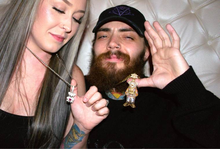 Clients showing off their custom teddy bear pendants