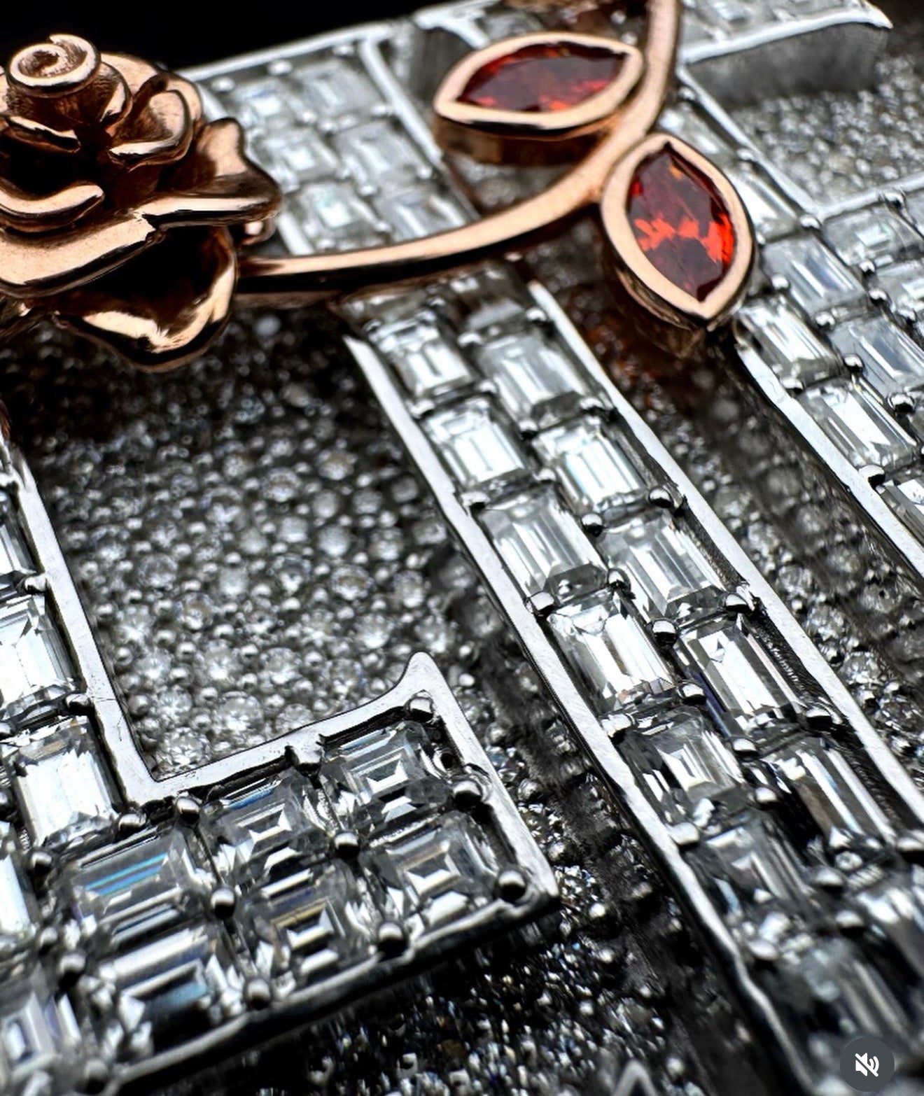 Macro shot of hand-set baguette diamonds on a custom Mars Jewelers pendant